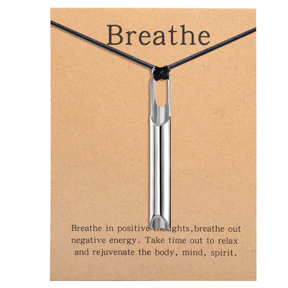Pendant necklace with titanium and steel whistle