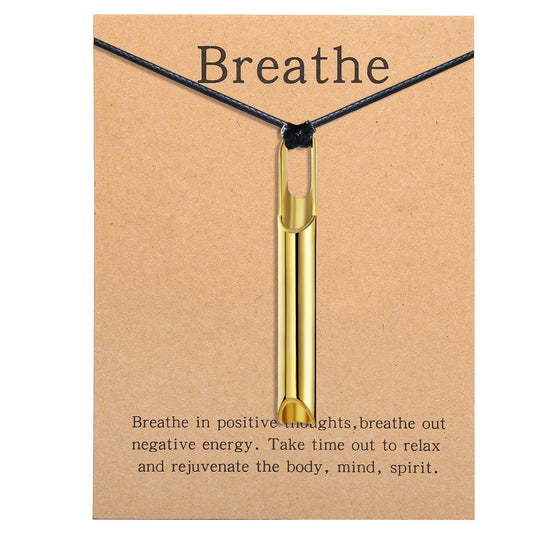 Pendant necklace with titanium and steel whistle