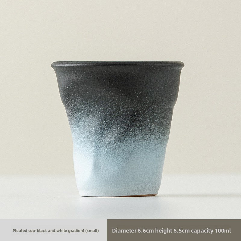 Pinch the ceramic pleated cup by hand
