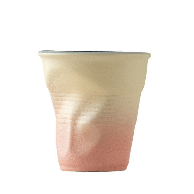 Pinch the ceramic pleated cup by hand