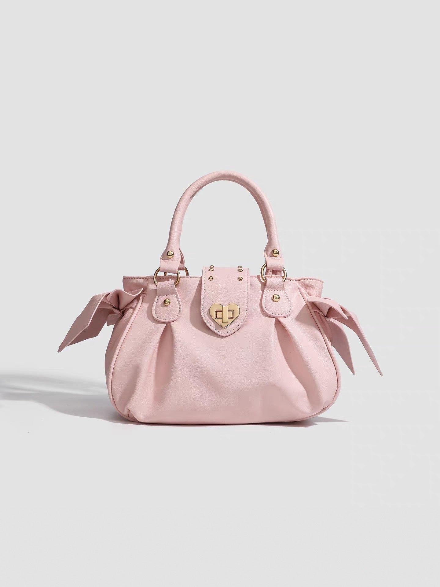 Pink pleated handbag