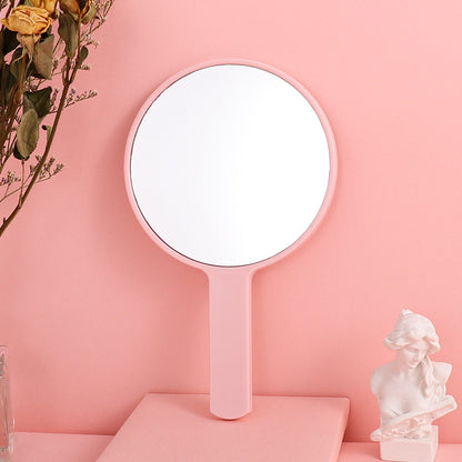 Portable plastic round-handled makeup mirror