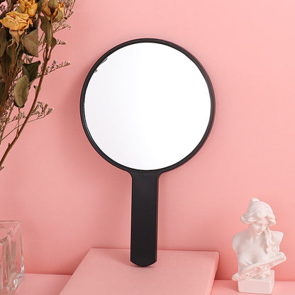 Portable plastic round-handled makeup mirror