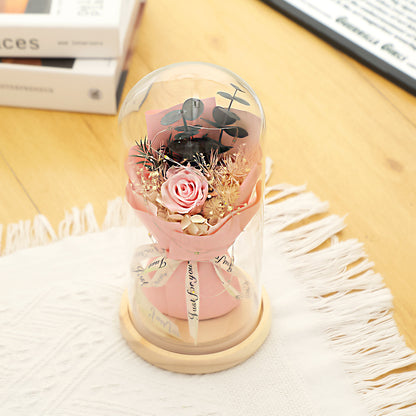 Preserved flower ornament under glass dome