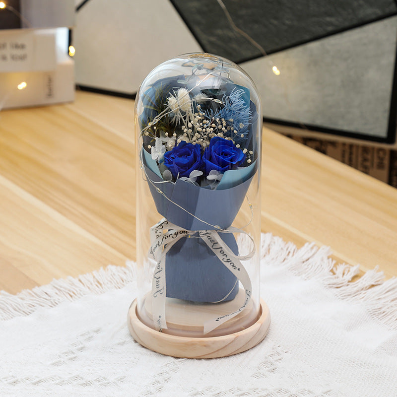 Preserved flower ornament under glass dome