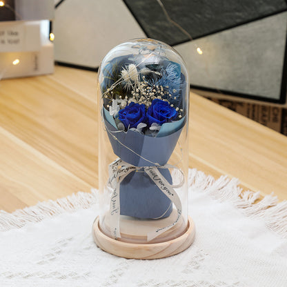 Preserved flower ornament under glass dome