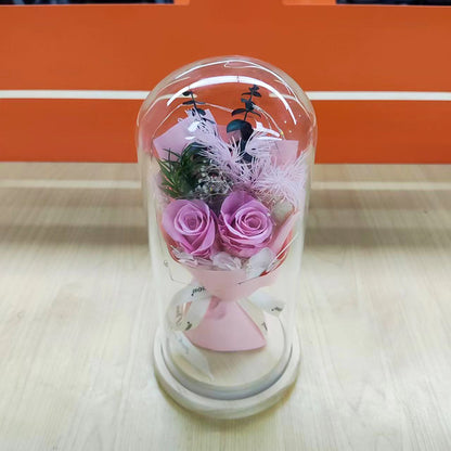 Preserved flower ornament under glass dome