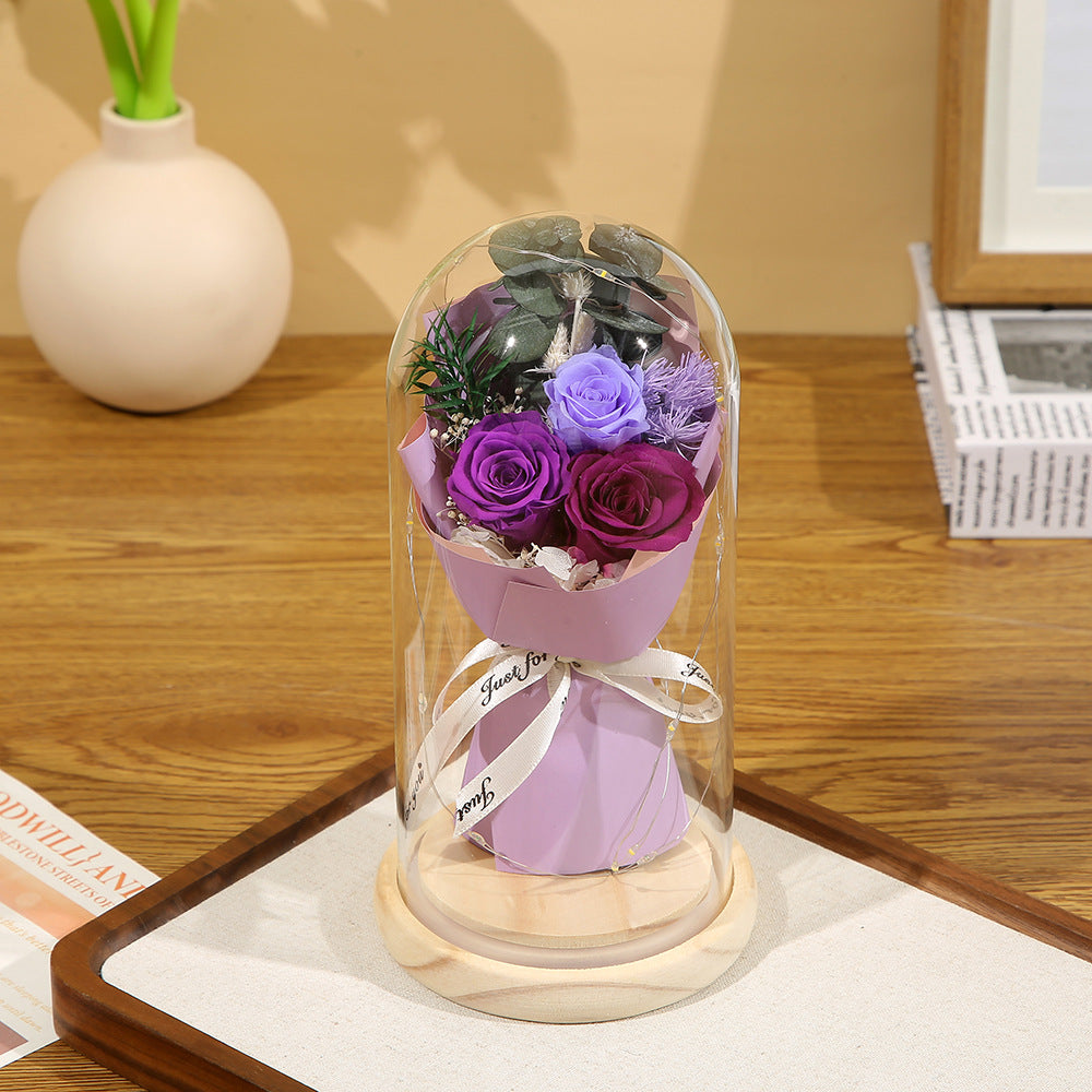 Preserved flower ornament under glass dome