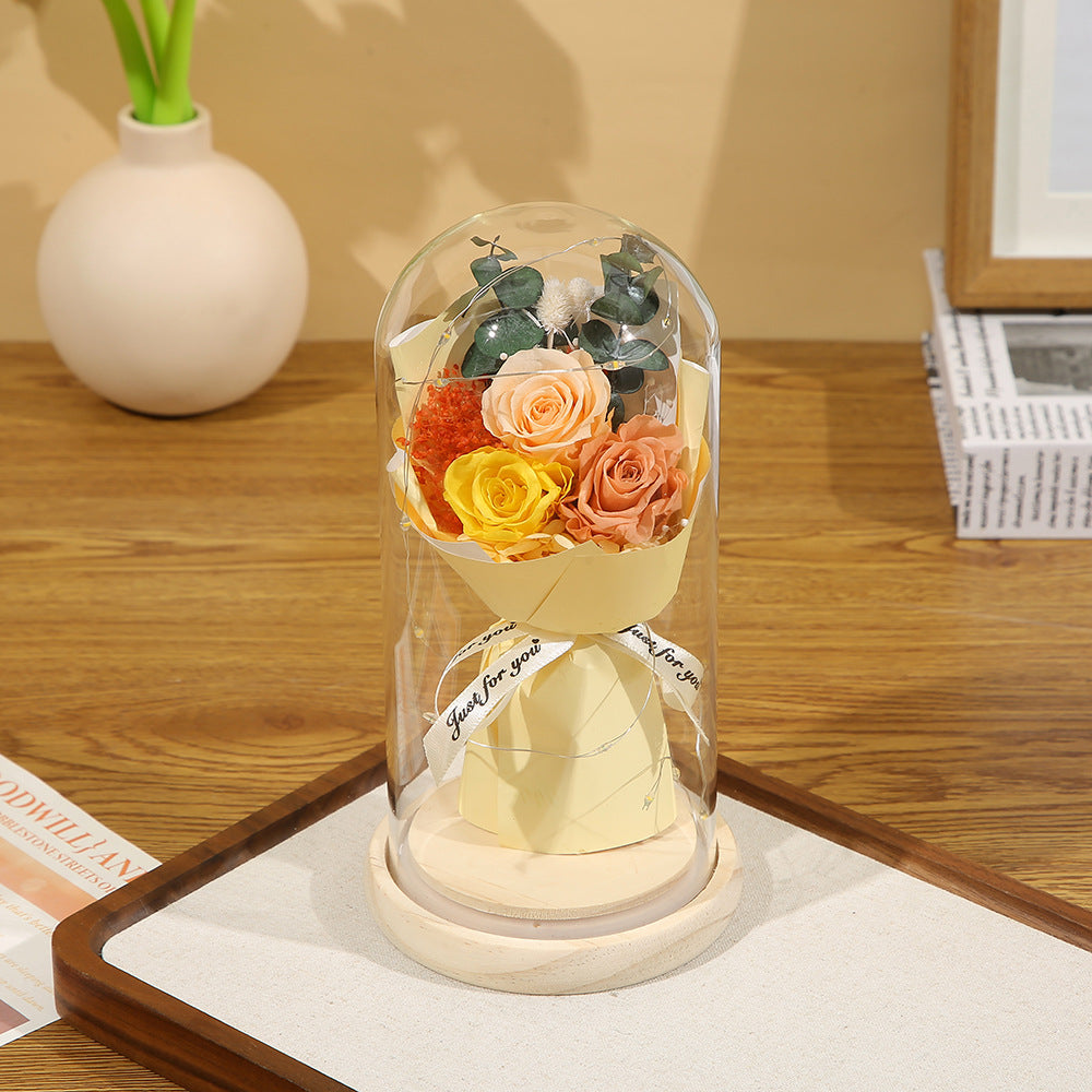Preserved flower ornament under glass dome