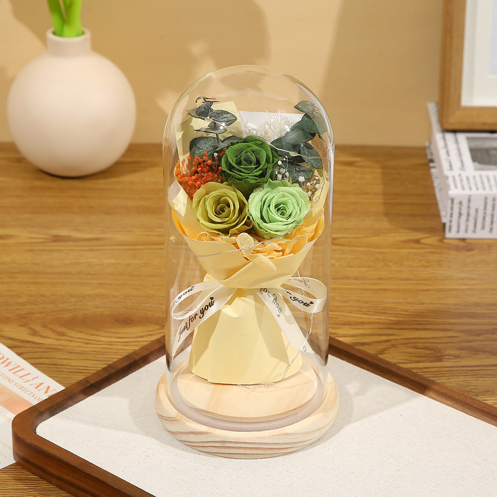Preserved flower ornament under glass dome