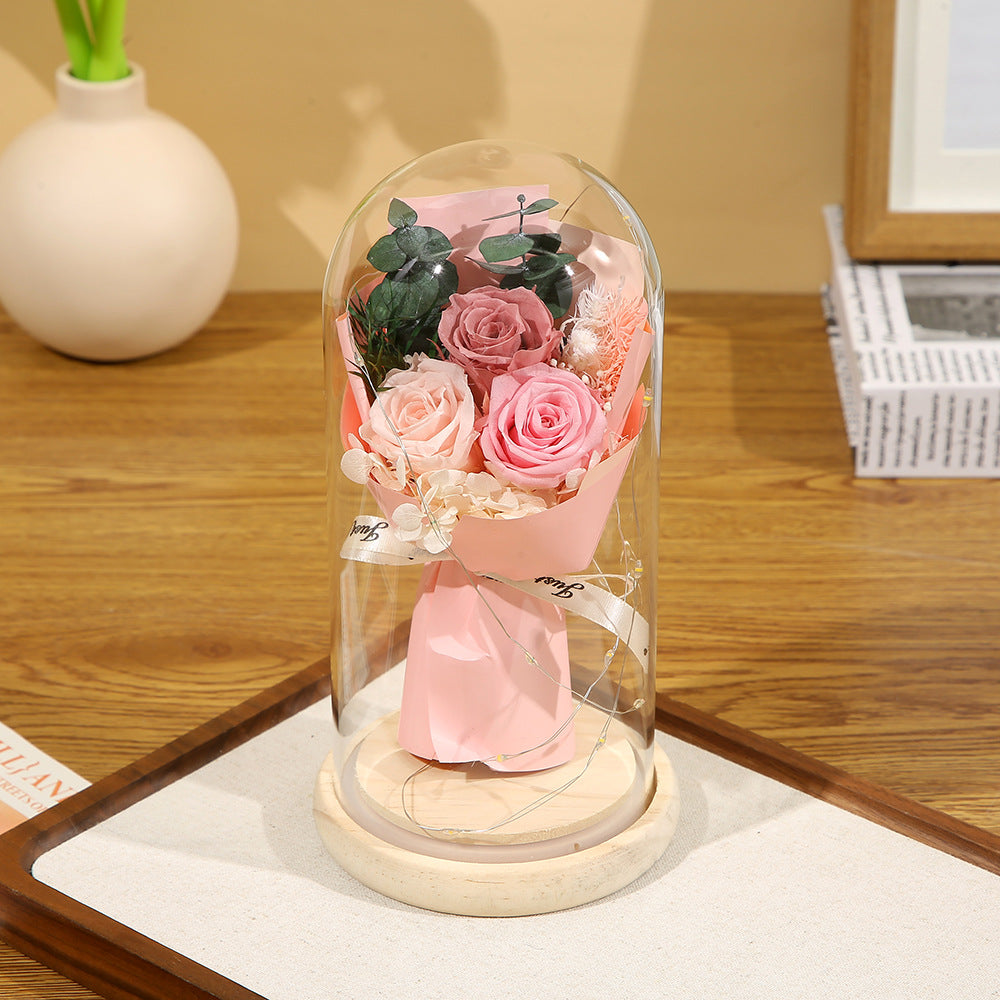 Preserved flower ornament under glass dome