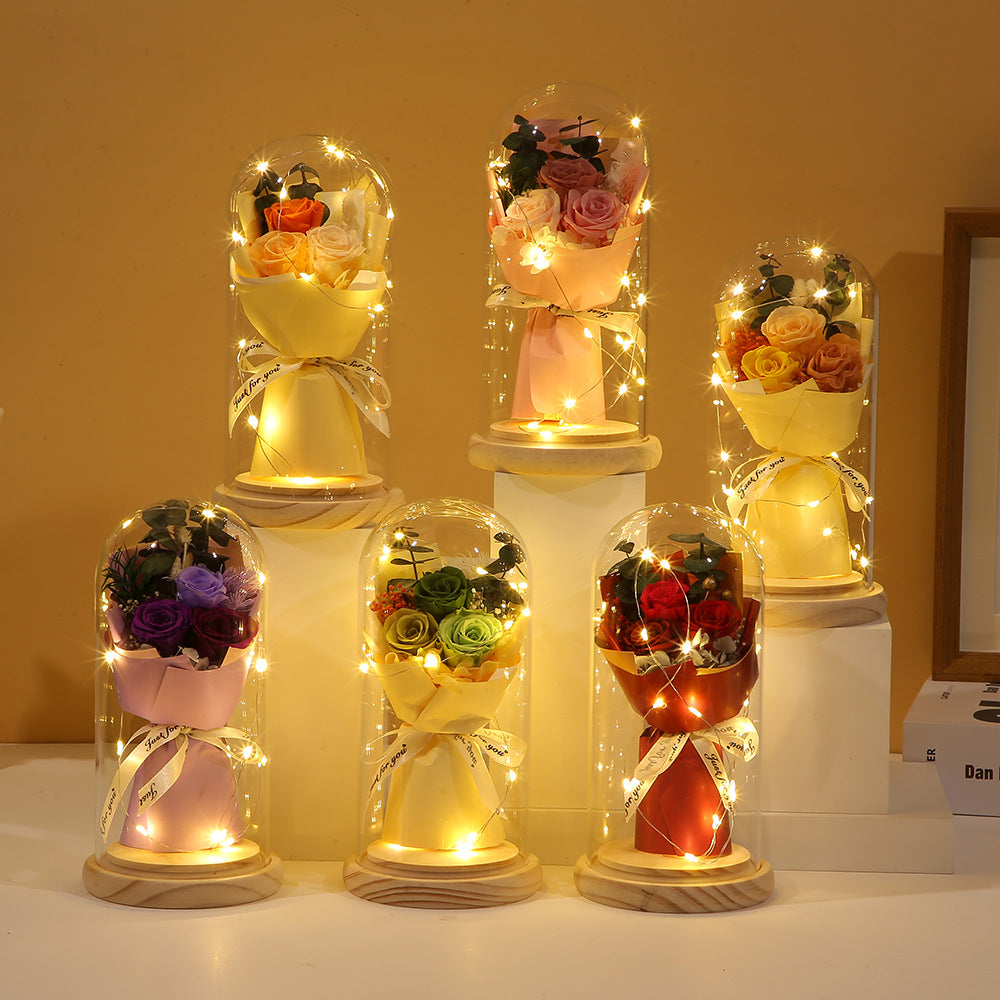 Preserved flower ornament under glass dome