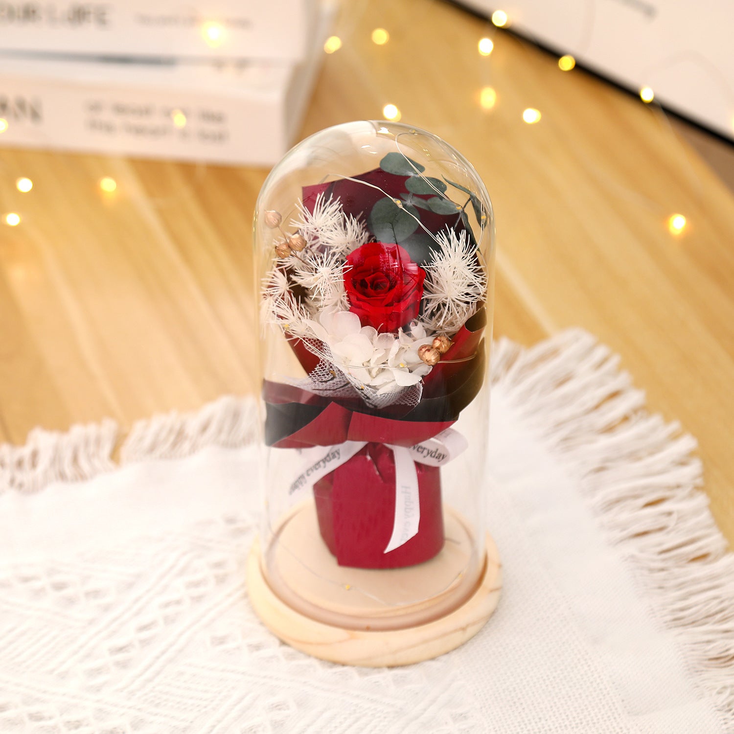 Preserved flower ornament under glass dome