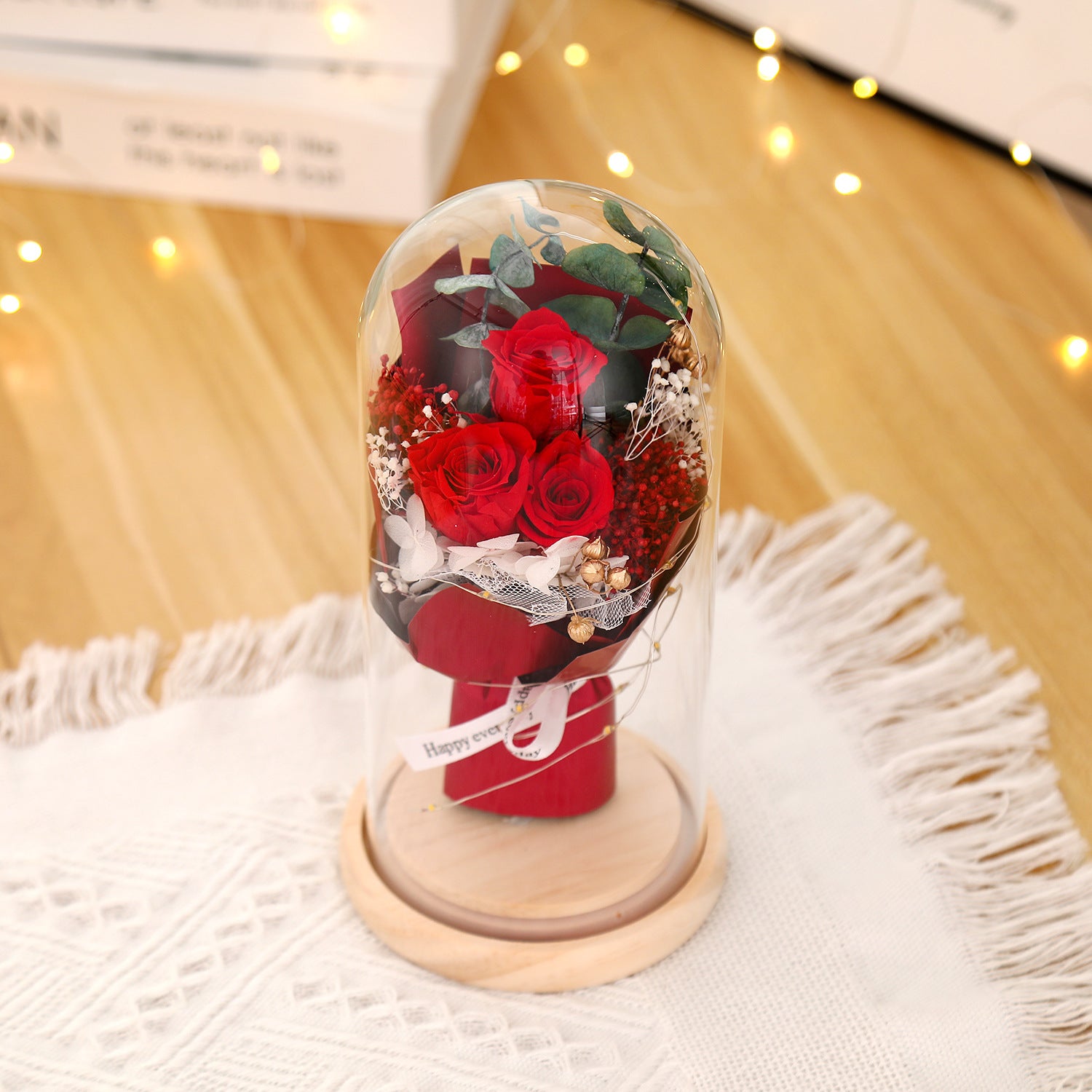 Preserved flower ornament under glass dome