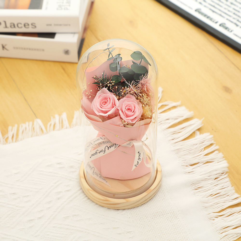 Preserved flower ornament under glass dome