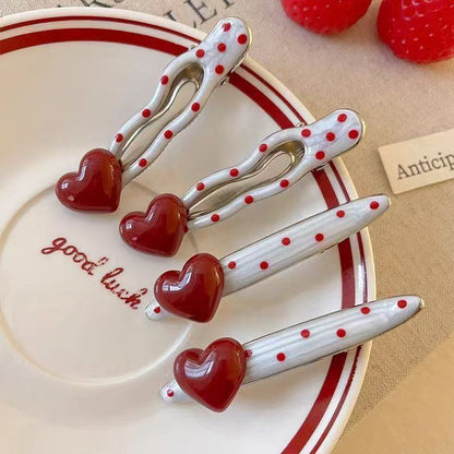 Red heart-shaped cherry polka dot hairpin