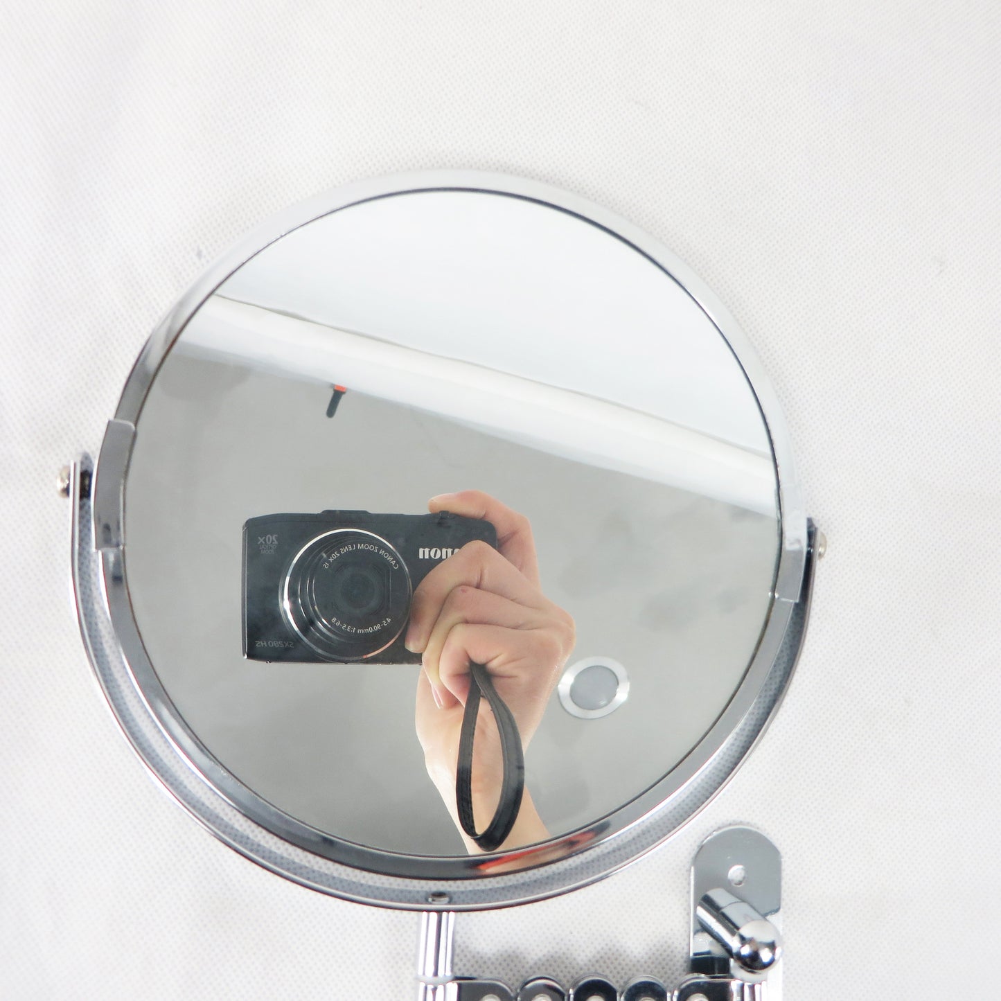 Retractable wall-mounted mirror