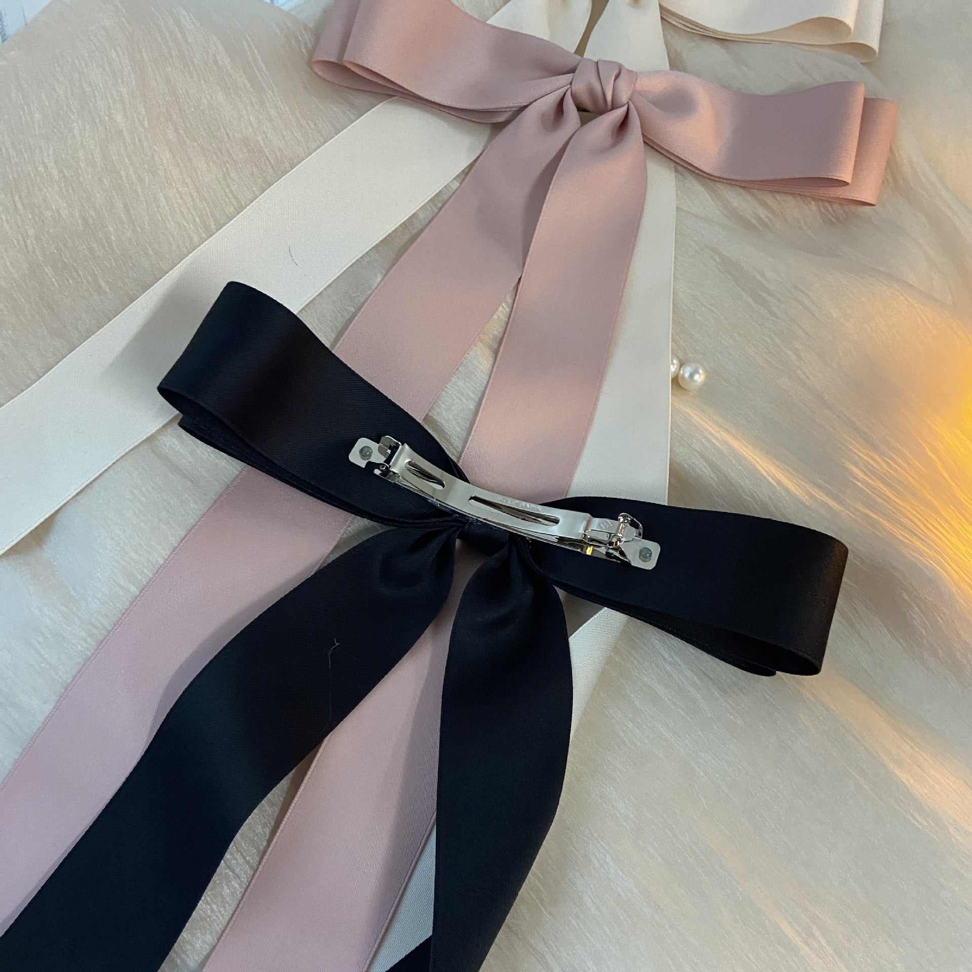 Ribbon spring clip headwear with ribbon edge