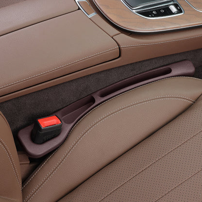 Seat gap filler strip