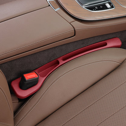 Seat gap filler strip