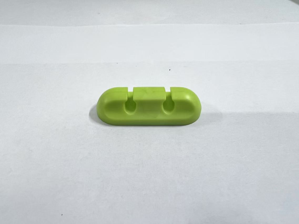 Self-adhesive silicone cable organizer for desktop wire management
