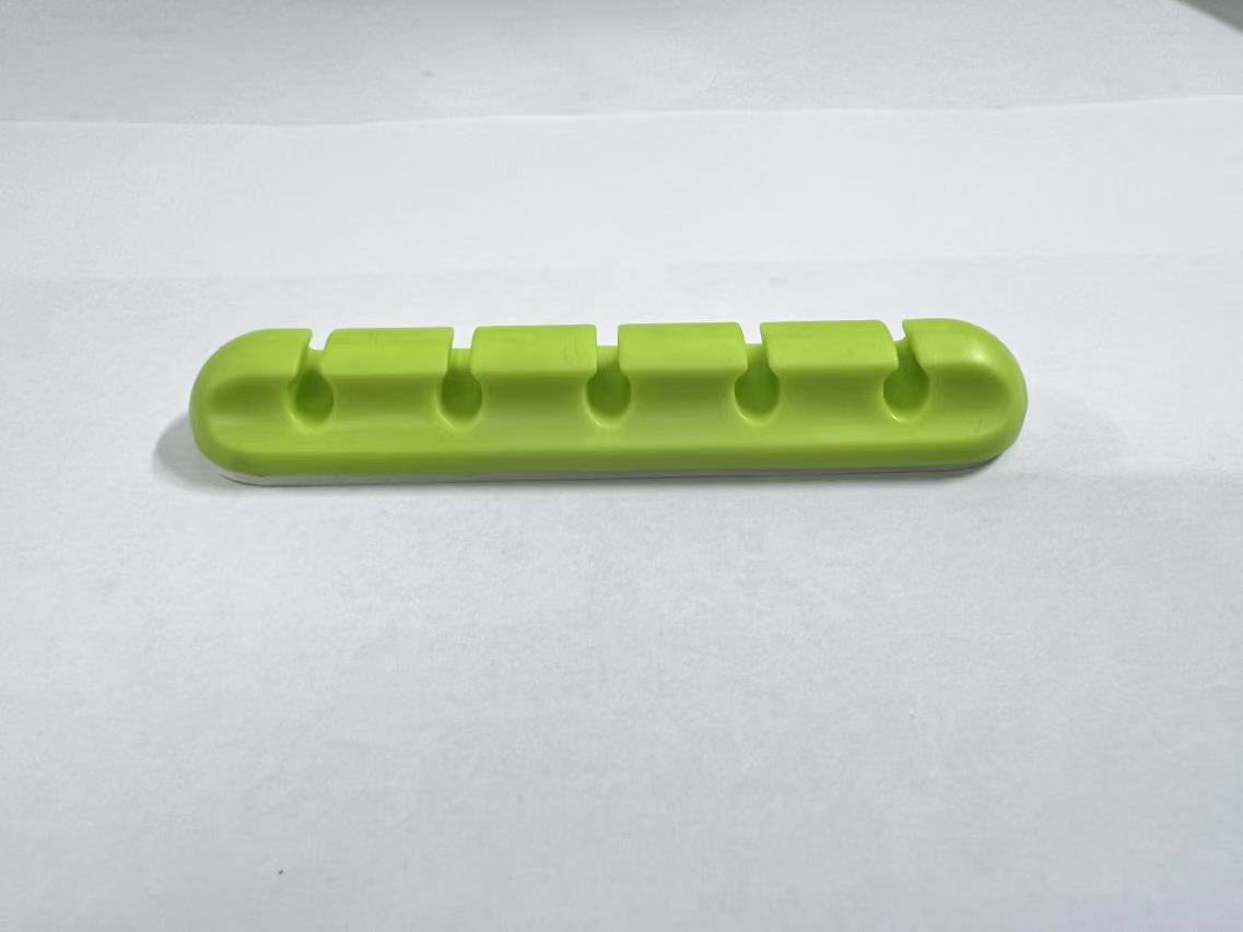 Self-adhesive silicone cable organizer for desktop wire management