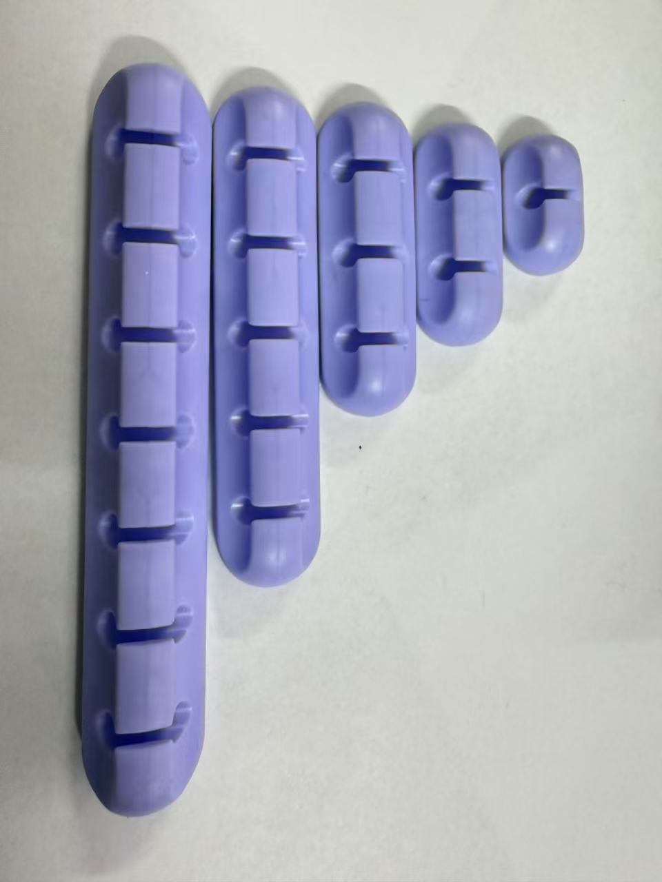 Self-adhesive silicone cable organizer for desktop wire management