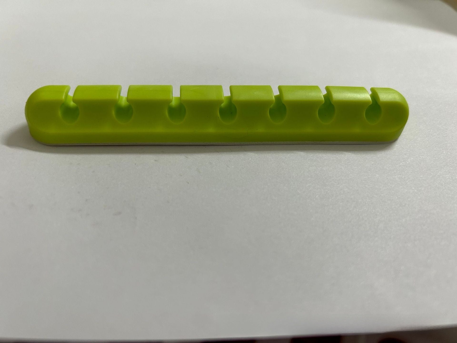 Self-adhesive silicone cable organizer for desktop wire management