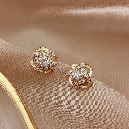 Silver needle hollowed-out circular earrings