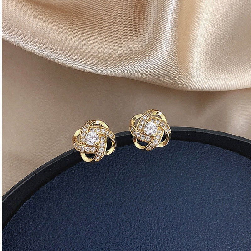 Silver needle hollowed-out circular earrings