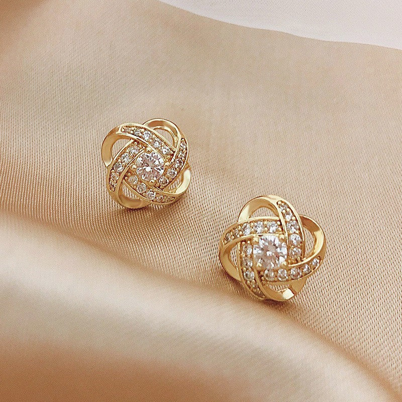 Silver needle hollowed-out circular earrings
