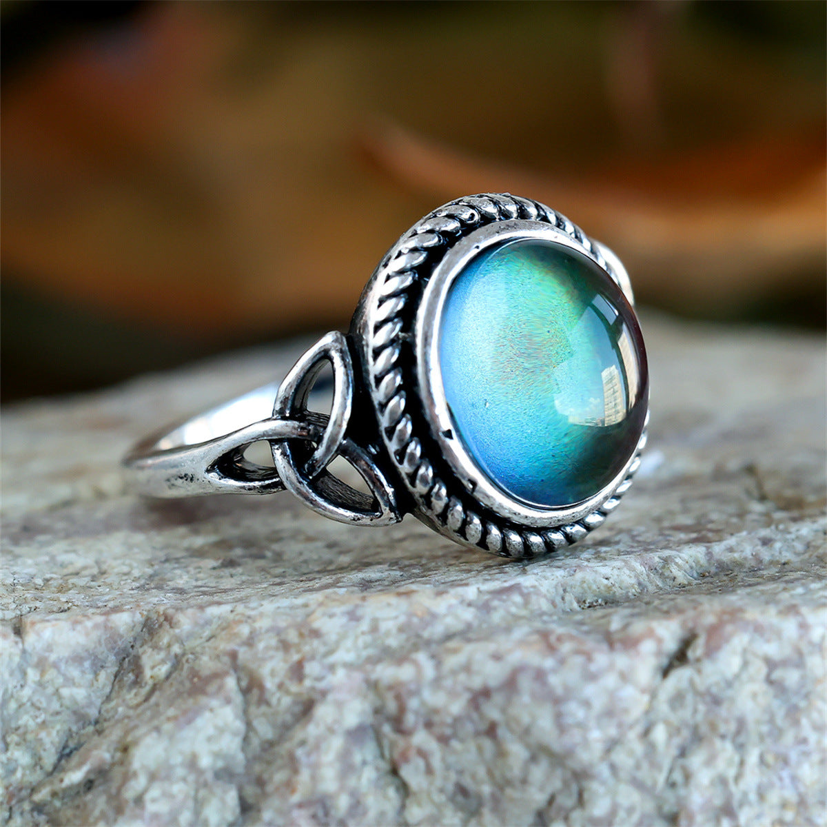 Silver-plated black egg-shaped ring
