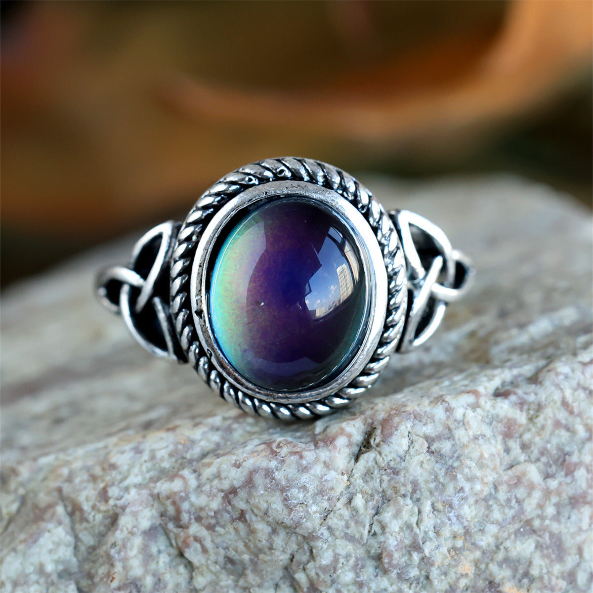 Silver-plated black egg-shaped ring