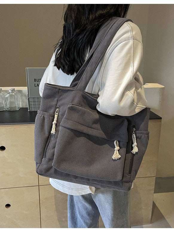 Simple corduroy tote bag for women, large capacity, suitable for daily commuting.