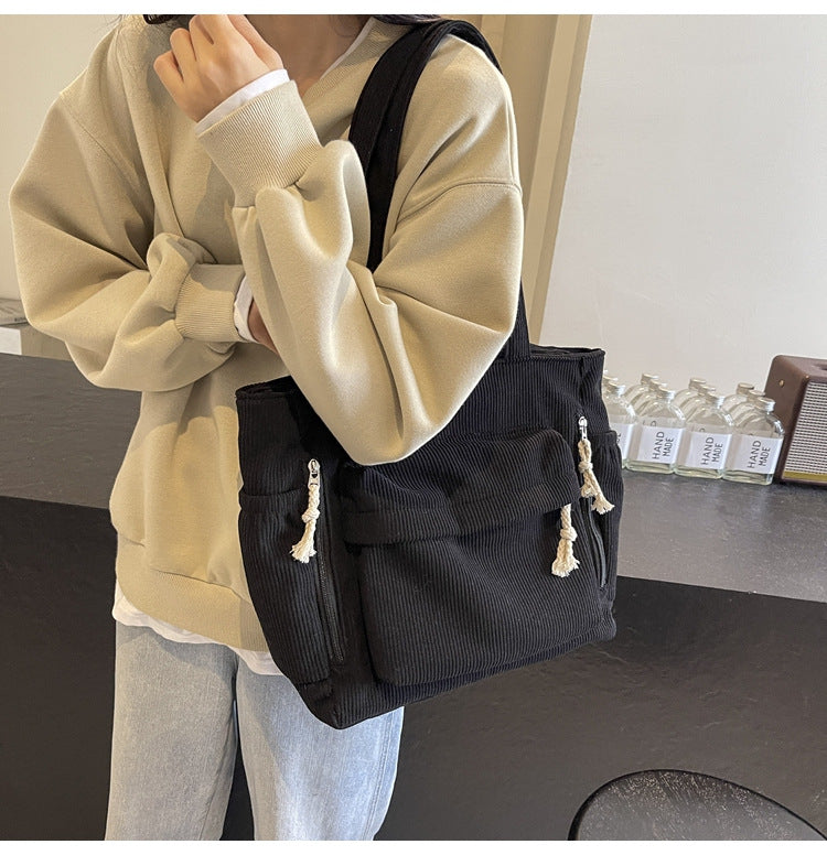 Simple corduroy tote bag for women, large capacity, suitable for daily commuting.