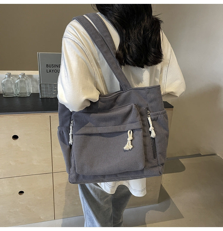 Simple corduroy tote bag for women, large capacity, suitable for daily commuting.