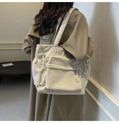 Simple corduroy tote bag for women, large capacity, suitable for daily commuting.