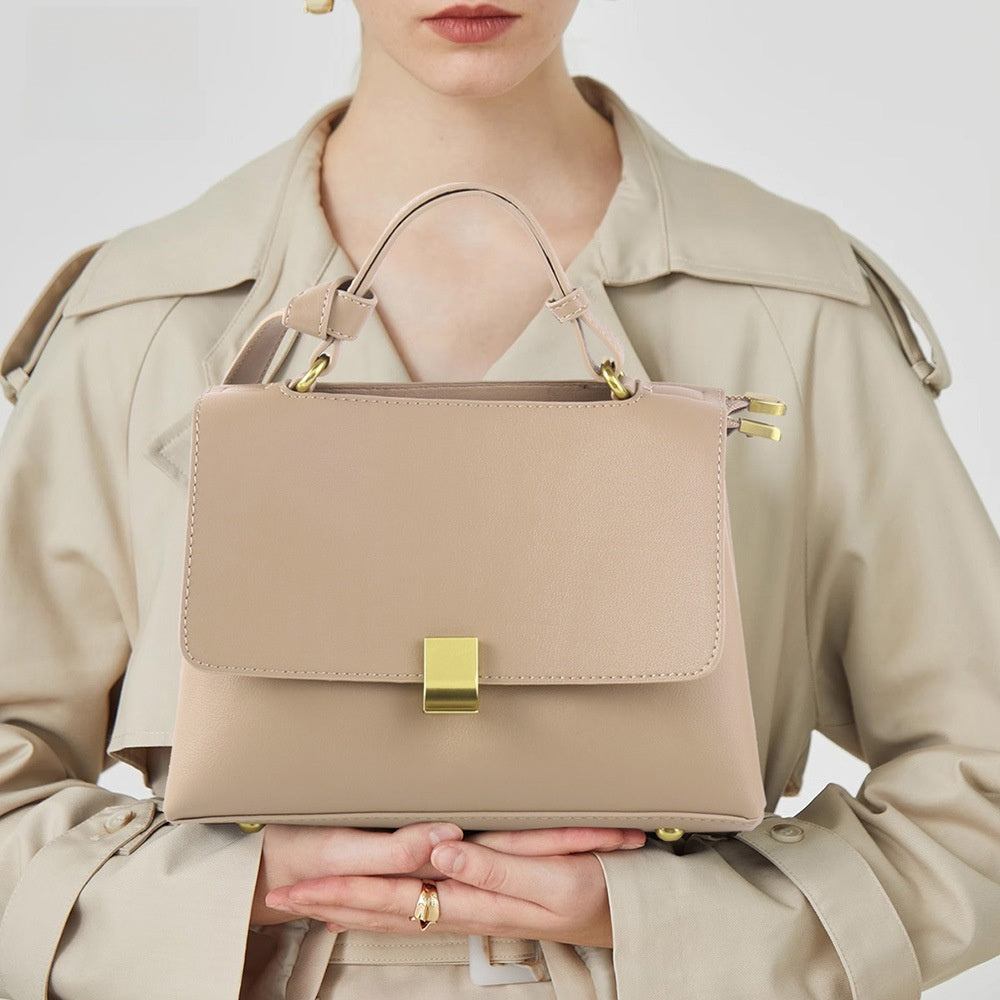 Simple solid color handbag with a slouchy shoulder strap