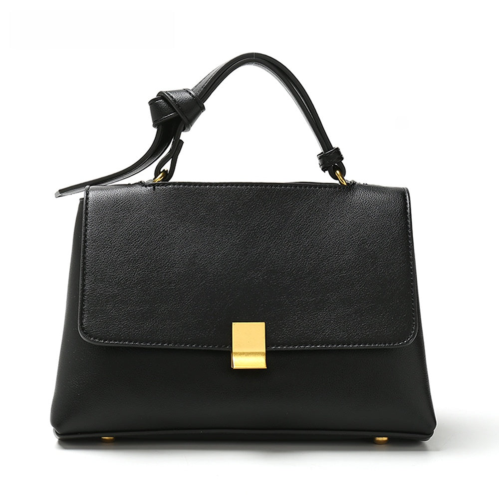 Simple solid color handbag with a slouchy shoulder strap