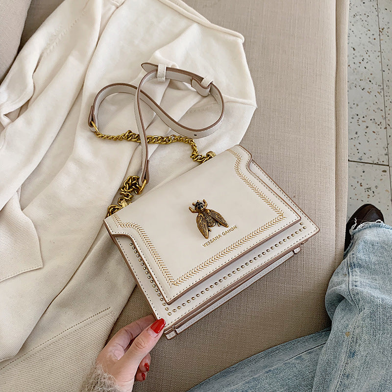 Single-shoulder handbag with a small square shape