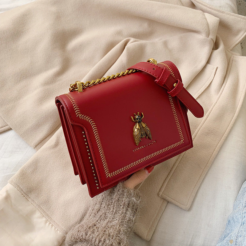 Single-shoulder handbag with a small square shape