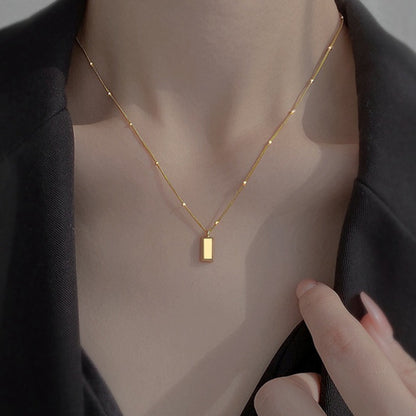 Small gold brick necklace