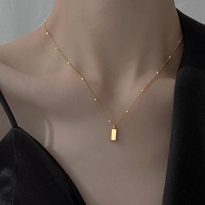 Small gold brick necklace