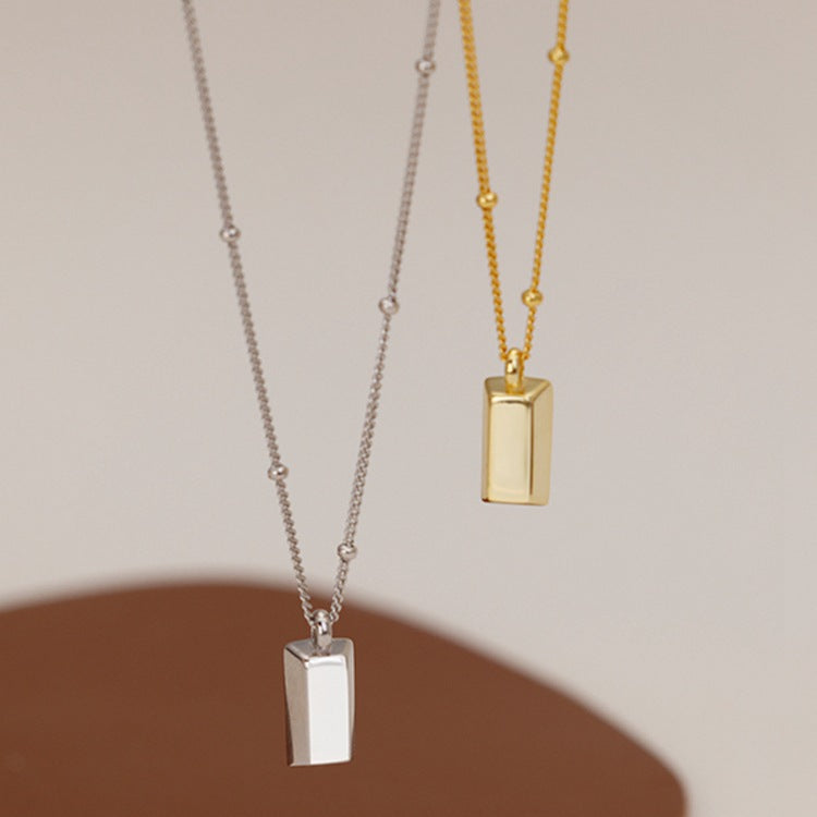 Small gold brick necklace
