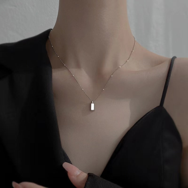 Small gold brick necklace