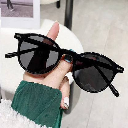 Small round-framed sunglasses