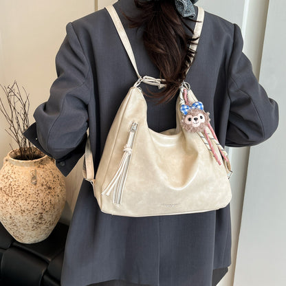 Soft leather shoulder bag with a slanted strap