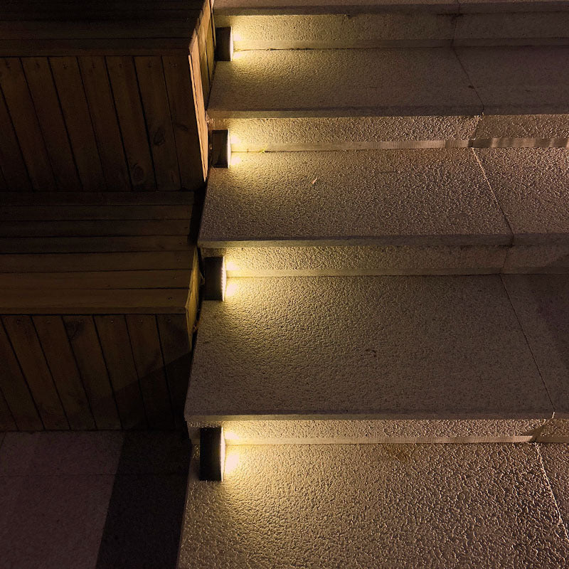 Solar-powered triangular step lamp