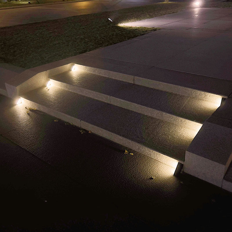 Solar-powered triangular step lamp