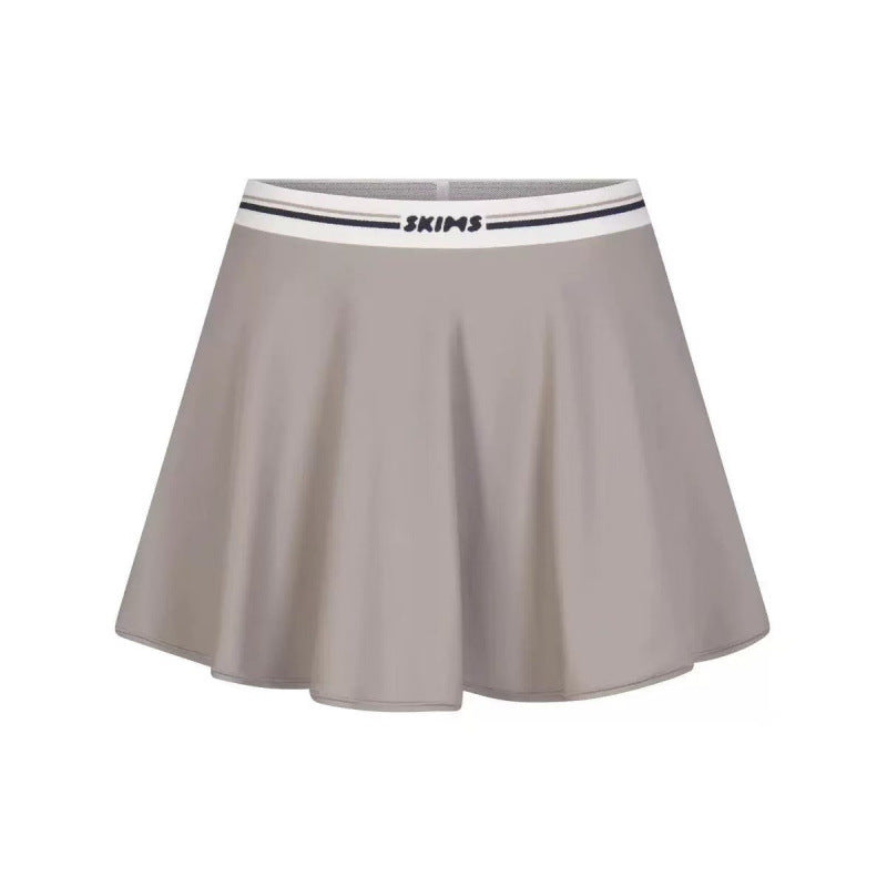 Sports skirt set with bra straps and midriff-baring design
